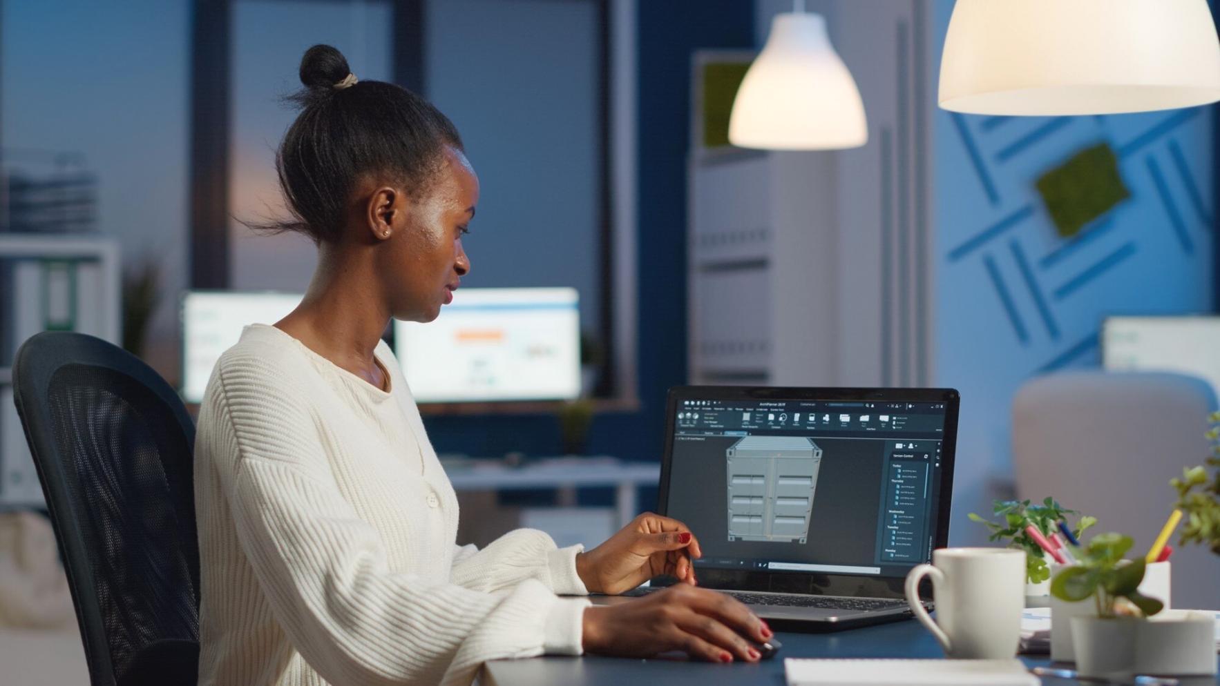 Students collaborating on web design projects in a modern learning environment