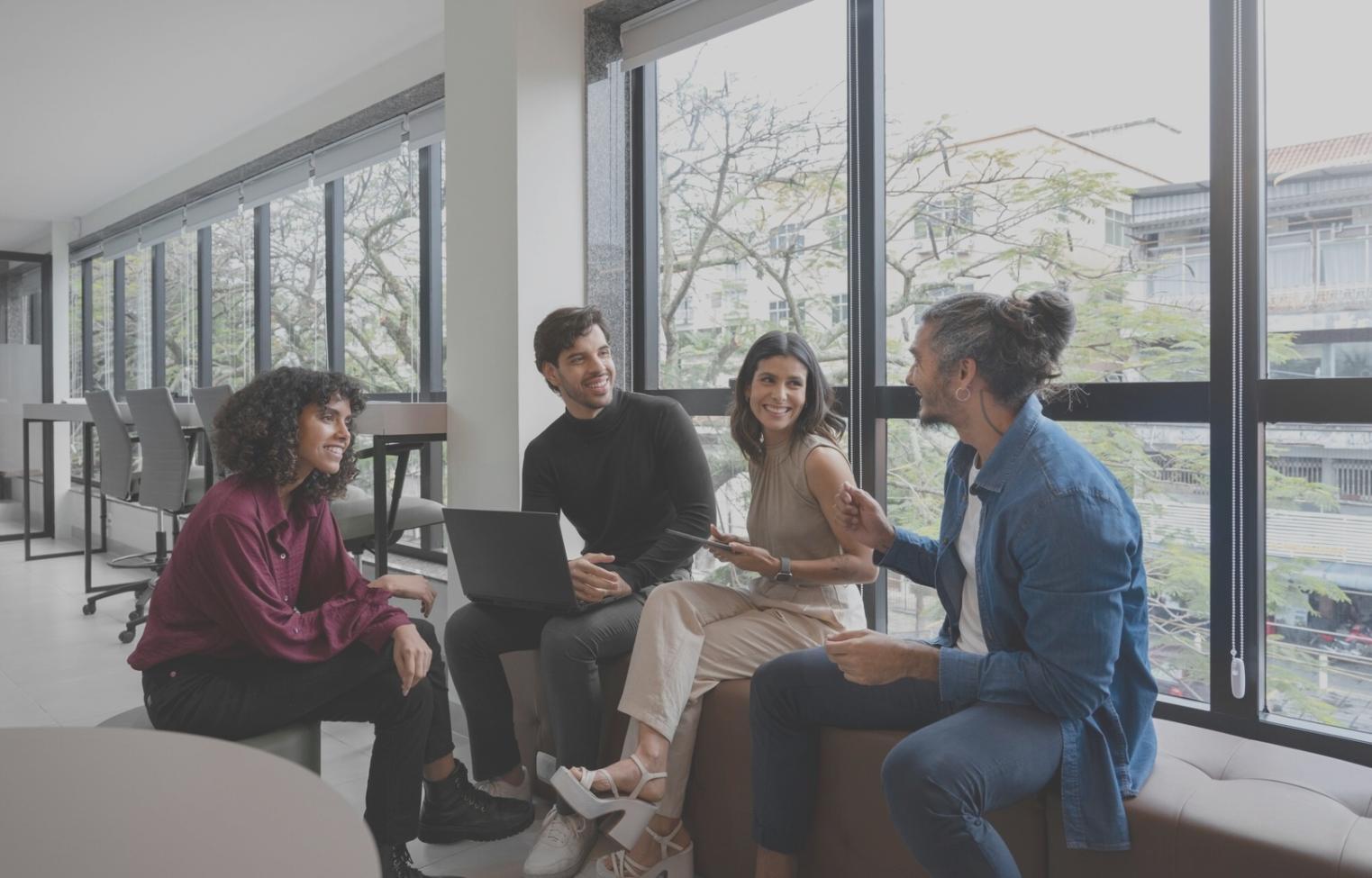 Students collaborating on web design projects in a modern classroom setting